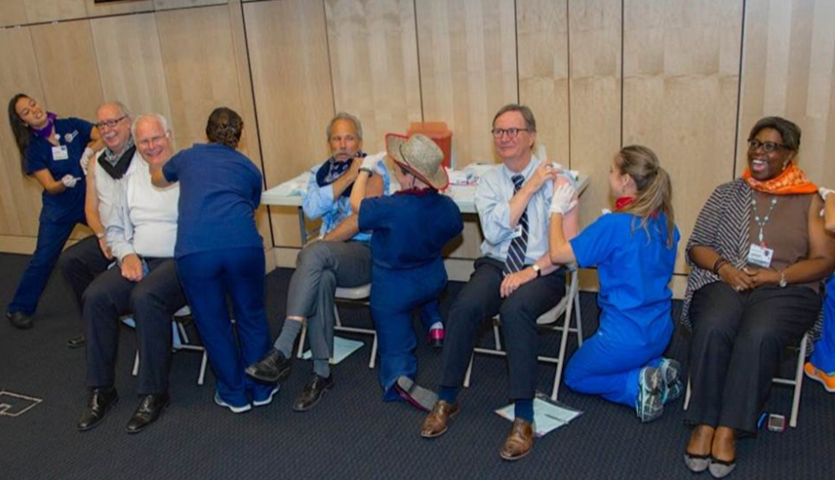 UCSF Health executives are given their flu shot by nurses